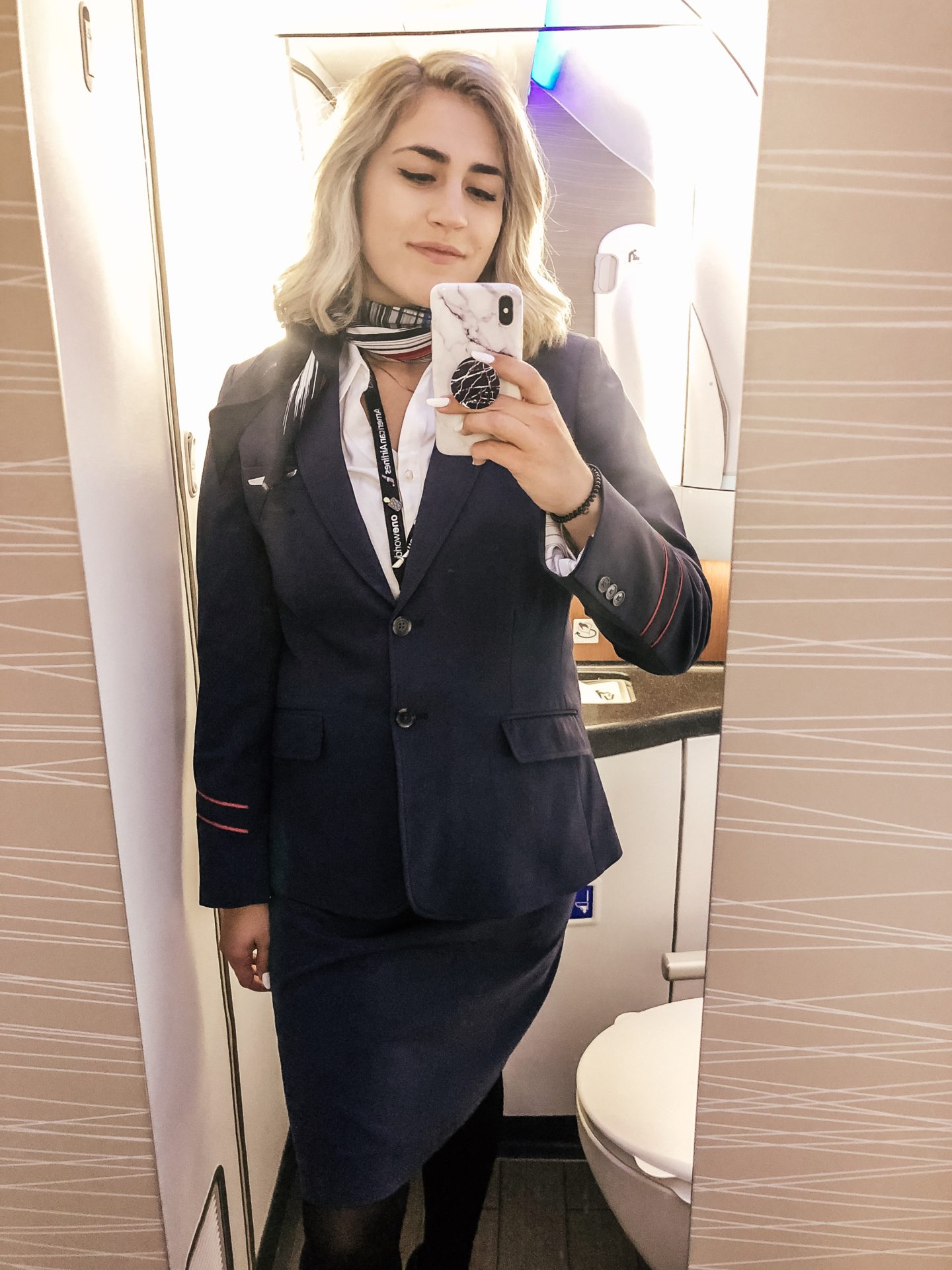 flight attendant life in airplane mirror