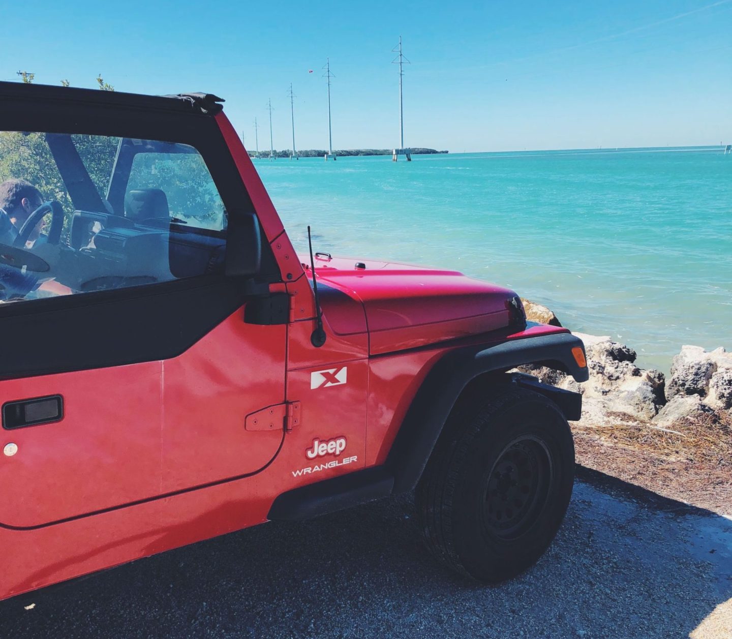 red vintage jeep in the florida keys road